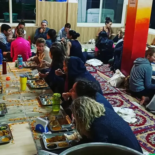 students having dinner at 7 Chakras Yoga School